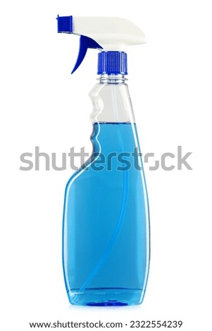 Blue detergent in a spray bottle. Isolated on white background. File contains clipping path