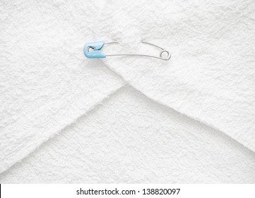 Blue Diaper / Nappy Safety Pin Inserted Into Folded Cloth