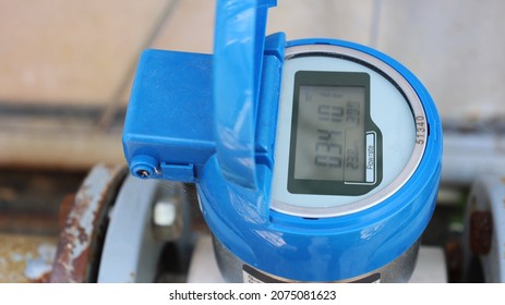 Blue Digital Water Meter. Dirty Electronic Tap Water Flow Meter With Digital Display. Close-up And Selected Focus