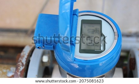Blue digital water meter. Dirty electronic tap water flow meter with digital display. Close-up and selected focus