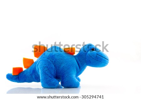 Blue dinosaur plush toy isolated on white. This dinosaur doll also called stegosaurus