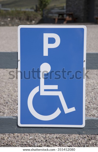 Blue Disabled\
Parking Sign in Rural\
Setting