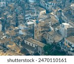 Blue dome of the Baroque style Chiesa di Santa Maria dell’Itria covered with eight Caltagirone terracotta panels decorated with large rococo flower vases in Ragusa Ibla Sicily Italy.