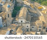 Blue dome of the Baroque style Chiesa di Santa Maria dell’Itria covered with eight Caltagirone terracotta panels decorated with large rococo flower vases in Ragusa Ibla Sicily Italy.