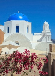 Blue Dome Churches And Bougenvilla Of Greece.