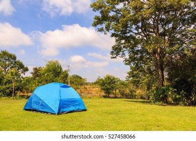 Blue dome tent on green grass campsite in Wang Nam Khiao, Thailand - Shutterstock ID 527458066