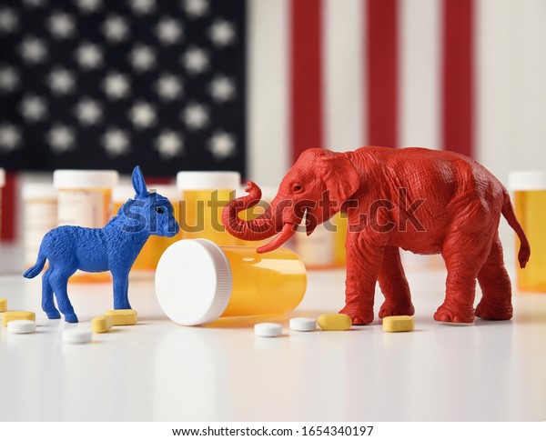 A blue donkey as a democrat and a\
red elephant as a republican are against an American flag with\
prescription pill bottles for a medical cost\
concept.