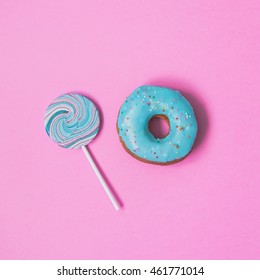 Blue Donut With Lollipop On Pink Background