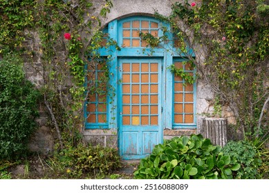 blue door in the former abbey of Landévennec, Brittany - Powered by Shutterstock