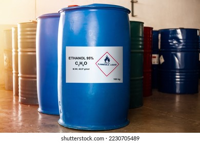 Blue drum size 160 kg of ethanol 95 percentage with the label of flammable liquid show caution for use. In addition, has a chemical barrel of other solvents beside it.