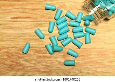 Blue Earplugs Scattered Around The Desk.