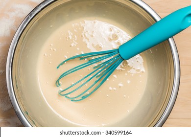 Blue Egg Beater And Batter In Mixing Bowl