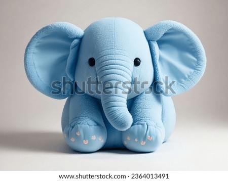 Blue elephant toy isolated on white background with shadow reflection. plush elephant toy for kids. Elephant plushie doll stuffed puppet on white backdrop.