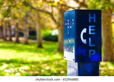 A Blue Emergency Phone Box Labeled “HELP” At A University Campus In Melbourne, Australia.