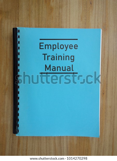 Blue Employee Training Manual On Desk Stock Photo (Edit Now) 1014270298