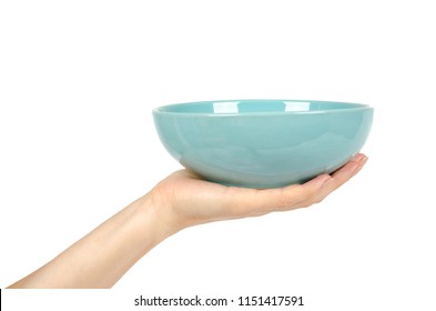 Blue empty ceramic bowl with hand isolated on white background.