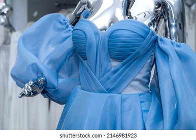 blue evening dress on mannequin for party bridesmaid wedding in bridal shop. fashion concept