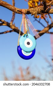 Blue Evil Eye ;nazar Boncugu, Turkish Symbols Hanging On A Tree. Cappadocia