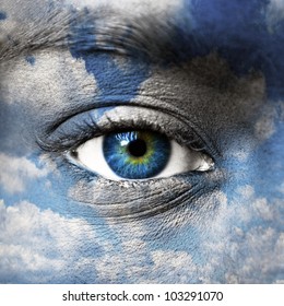 Blue eye with blue sky pattern - Spiritual concept - Shutterstock ID 103291070