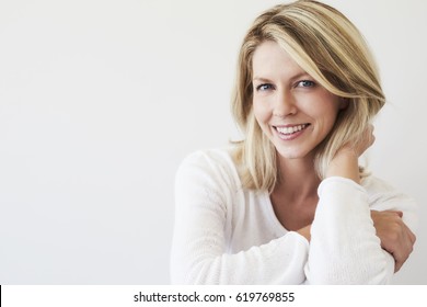 Blue Eyed Blond Woman Smiling To Camera