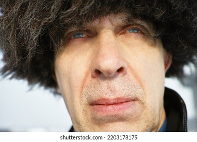 A Blue Eyed Man Wearing Fur Hat, Wintertime Outdoor Portrait