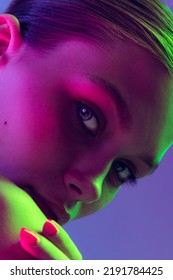 Blue Eyes. Close Up Eyes Of Beautiful Young Girl Looking Away In Pink Neon Light. Concept Of Cosmetics, Makeup, Natural And Eco Treatment, Skin Care. Shiny And Healthy Look, Fashion, Vision. Details