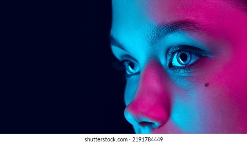 Blue Eyes. Close Up Eyes Of Beautiful Young Girl Looking Away In Pink Neon Light. Concept Of Cosmetics, Makeup, Natural And Eco Treatment, Skin Care. Shiny And Healthy Look, Fashion, Vision. Details