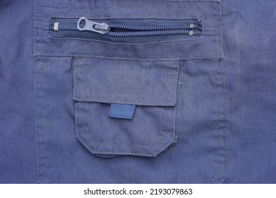 Blue Fabric Texture Of The Pants With A Pocket With Plastic Open Zip