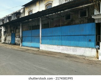 Blue Fenced Retro House In 1980s