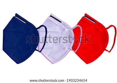 
A blue ffp2 or ffp3 mask, a white ffp2 or ffp3 mask, and a red ffp2 or ffp3 mask lined up in the center of a plain white background. Stock photo © 