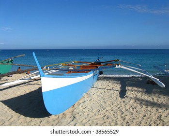 Blue Fishing Boat On The Shore Of Pagudpod, Ilocos Norte, Philippines