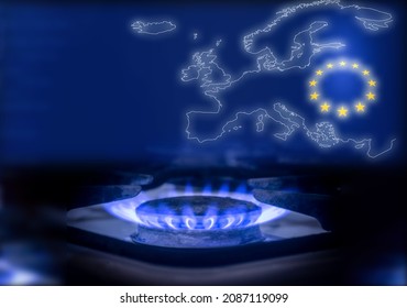 The blue flame of a gas stove in the dark. Gas burner on the background of the map and the flag of the European Union. The concept of gas consumption in Europe