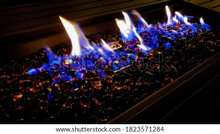 Blue Flames and Glass Marbles on a Fire Table