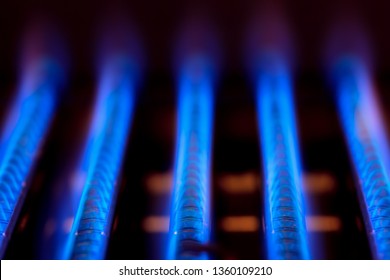 Blue Flames Of Natural Gas Burnning Inside Of A Boiler Furnace - Fossil Fuel Use Concept