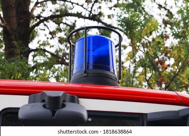 Blue Flashing Light On The Roof Of A Fire Truck Close Up