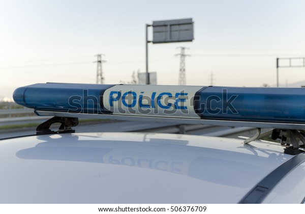 Blue flashing lights\
of the police car 