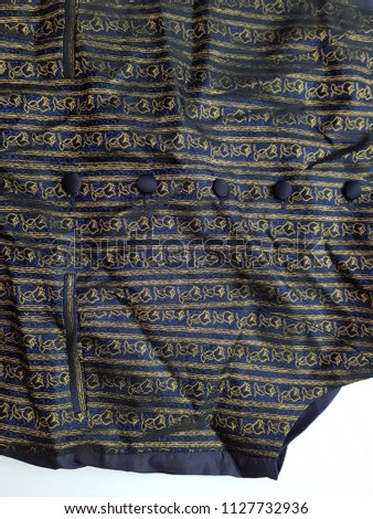Blue flower embroidery button down shirt. close up.