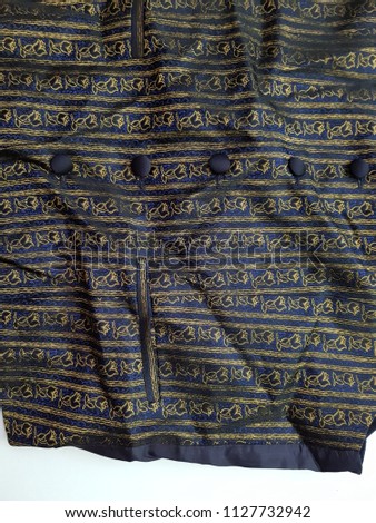 Blue flower embroidery button down shirt. close up.