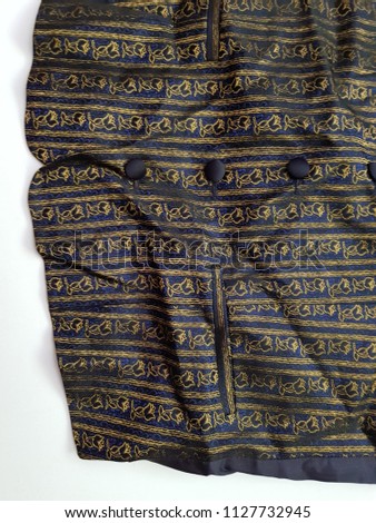 Blue flower embroidery button down shirt. close up.