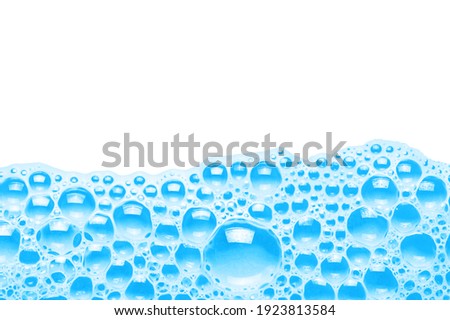 Blue foam bubble texture. Empty copy space abstract color water. Washing suds pattern background. Bubbles isolated on white. Cutout foam background.