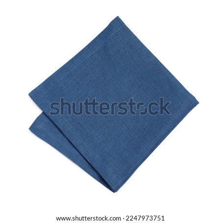 Blue folded fabric napkin on white background, top view