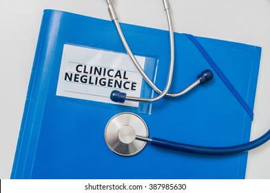 Blue Folder With Clinical Negligence. Medical Failure Concept.