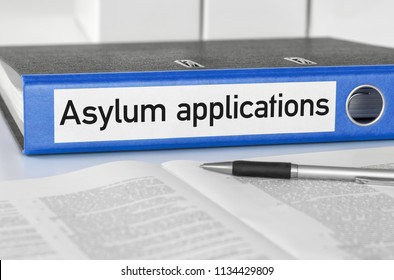 A blue folder with the label Asylum applications