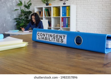 Blue folder with label contingent liabilities on desk. - Shutterstock ID 1983357896