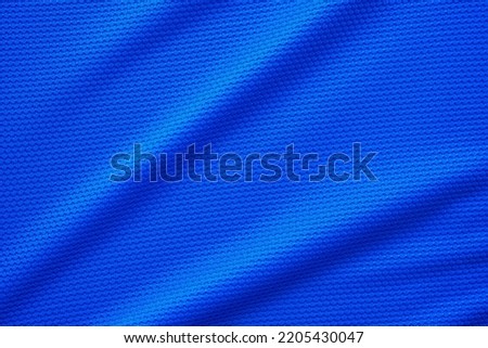 Blue football jersey clothing fabric texture sports wear background, close up top view