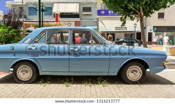 Blue Ford car parked somewhere in Argostoli,\
Kefalonia, Greece, 11 july\
2017