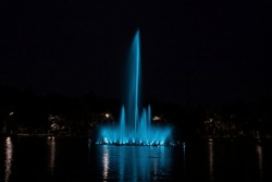 Blue Fountain At Night In The Pond