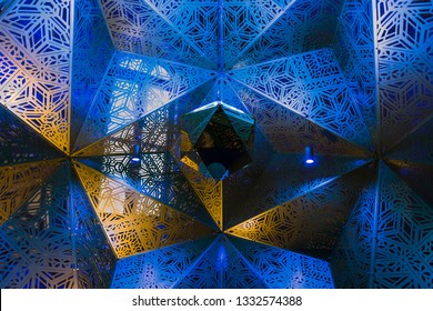 Blue Fractal Art Installation With Hanging Mirror.