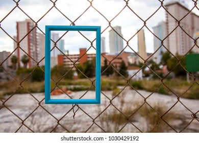 Blue Frame For Photograph. Fence From The Mesh. Mock Up.