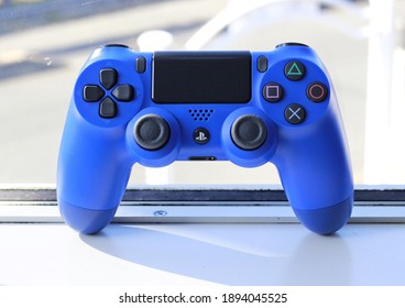 Blue Game Controller In White Background